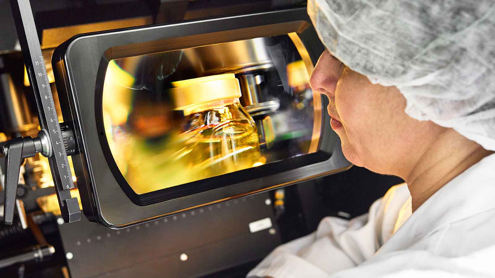 Woman inspecting product.